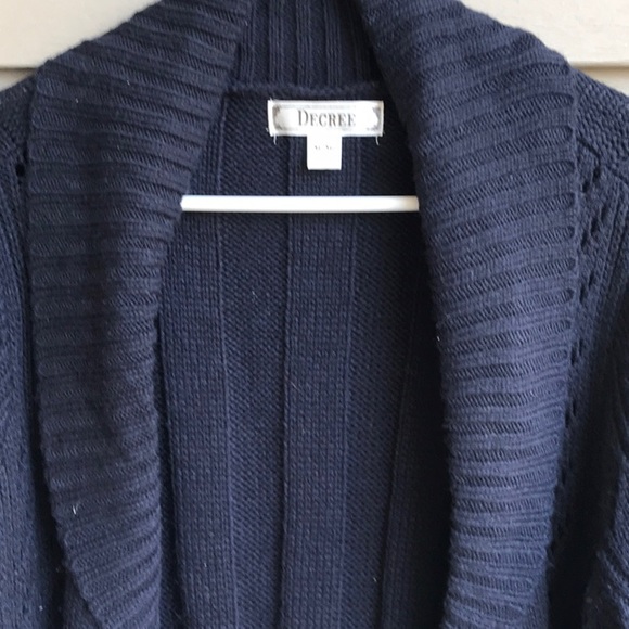 Go from winter to spring in this cute short sleeve navy blue cardigan. - Picture 3 of 8